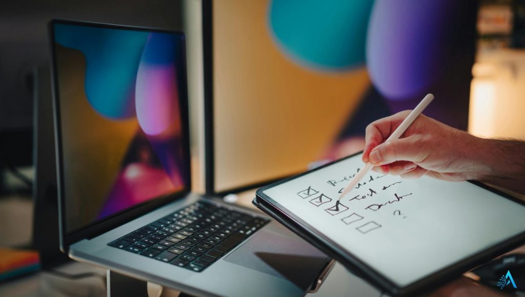Digital checklist on tablet in a modern creative workspace with AI tools and laptop screens in the background