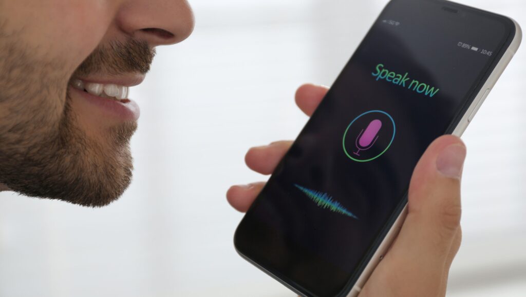 Person recording voice using a microphone for AI voice cloning or speech synthesis – 2025