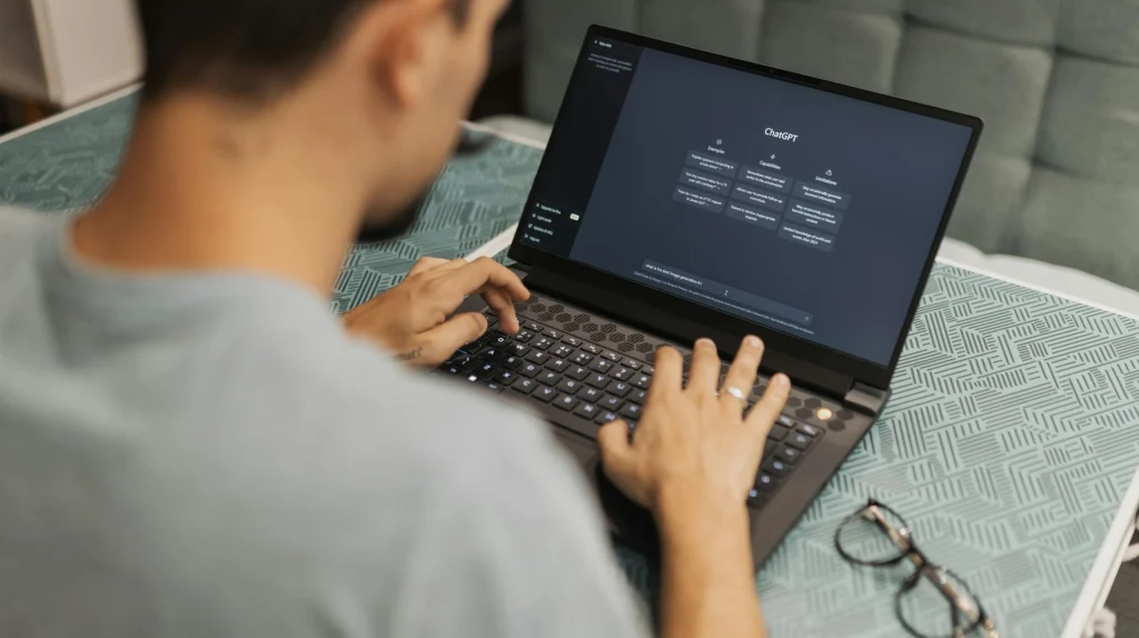 Person reviewing chatbot data collection settings on a laptop for privacy control